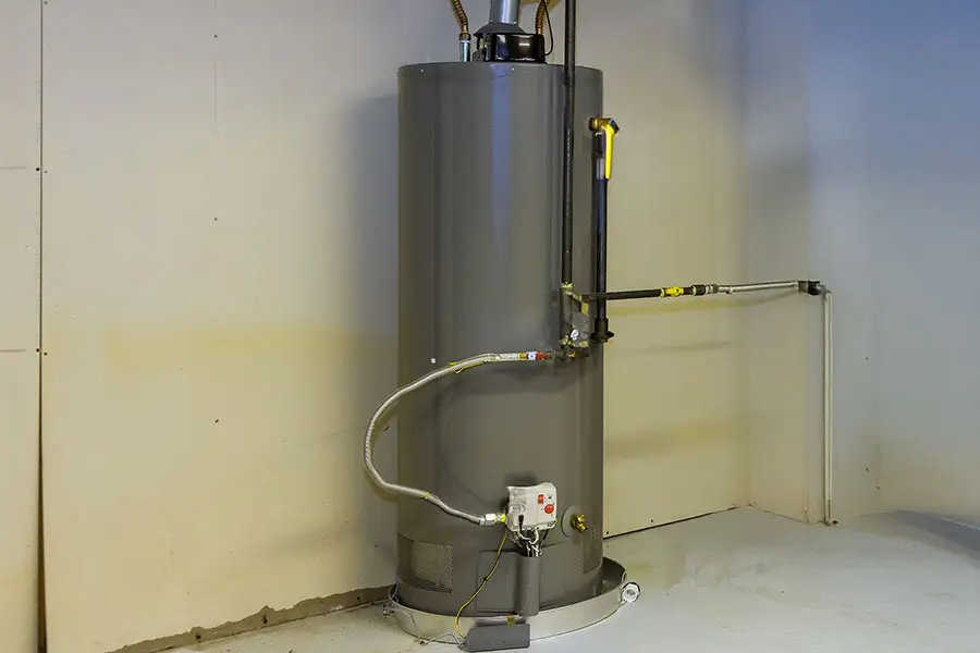 Leaking water heater being inspected