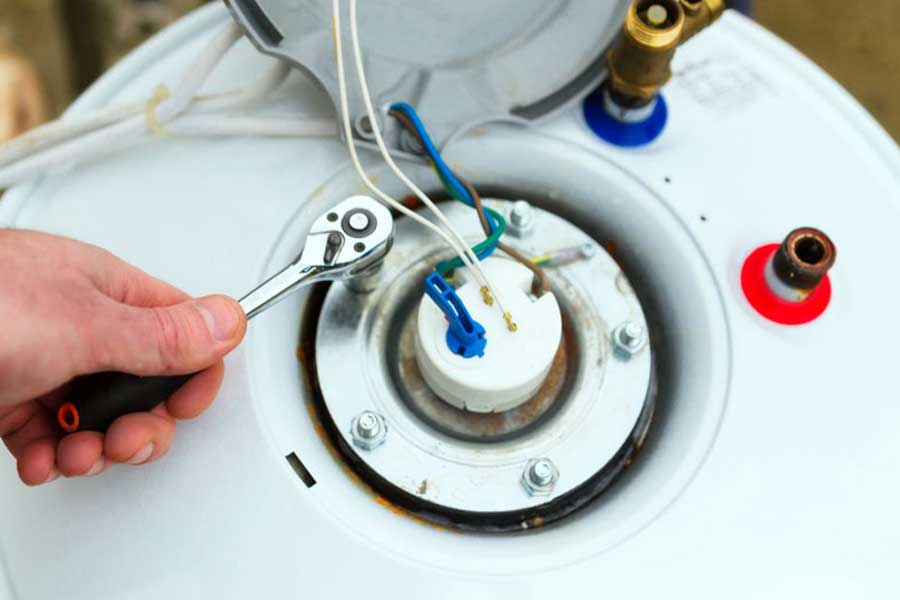Plumber fixing water heater
