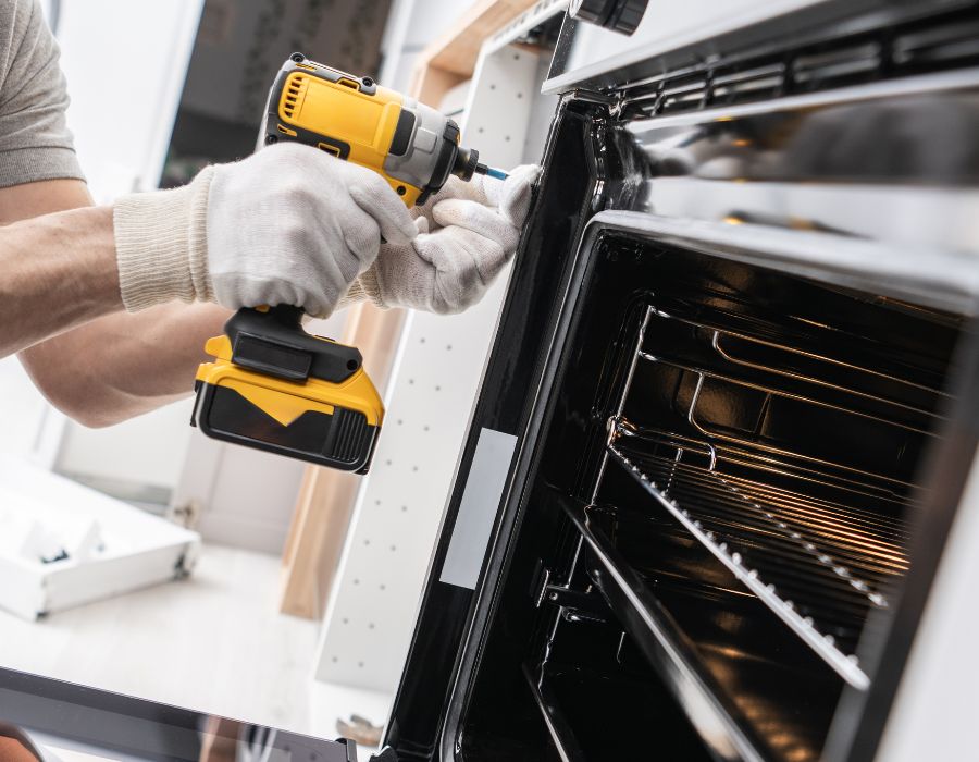 Plumber connecting home appliance