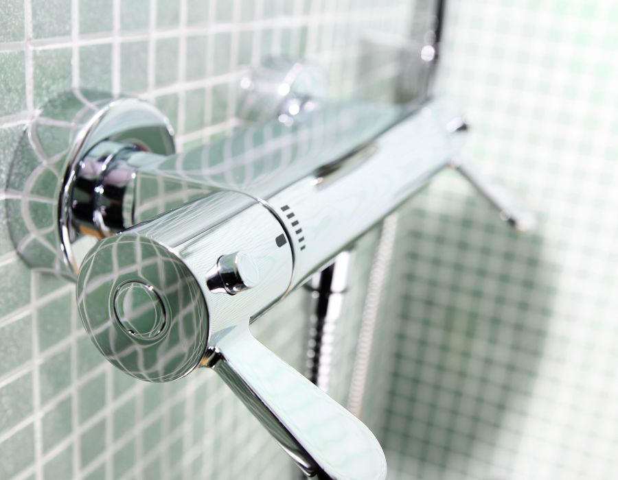 Plumber replacing shower valve