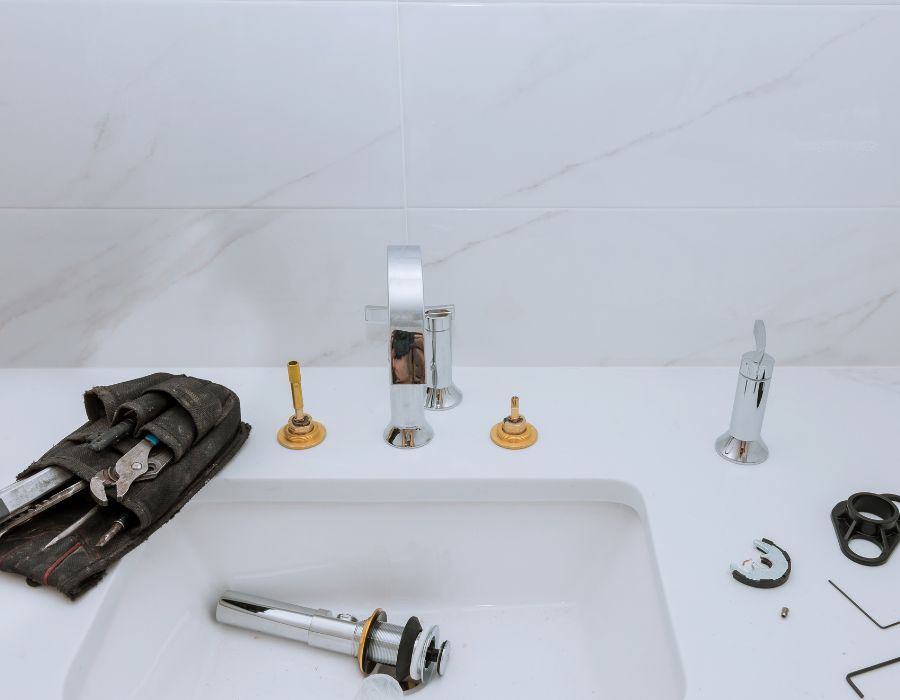Plumber installing new sink