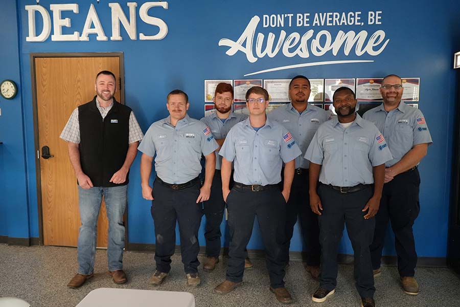 Dean's Plumbing team at the office